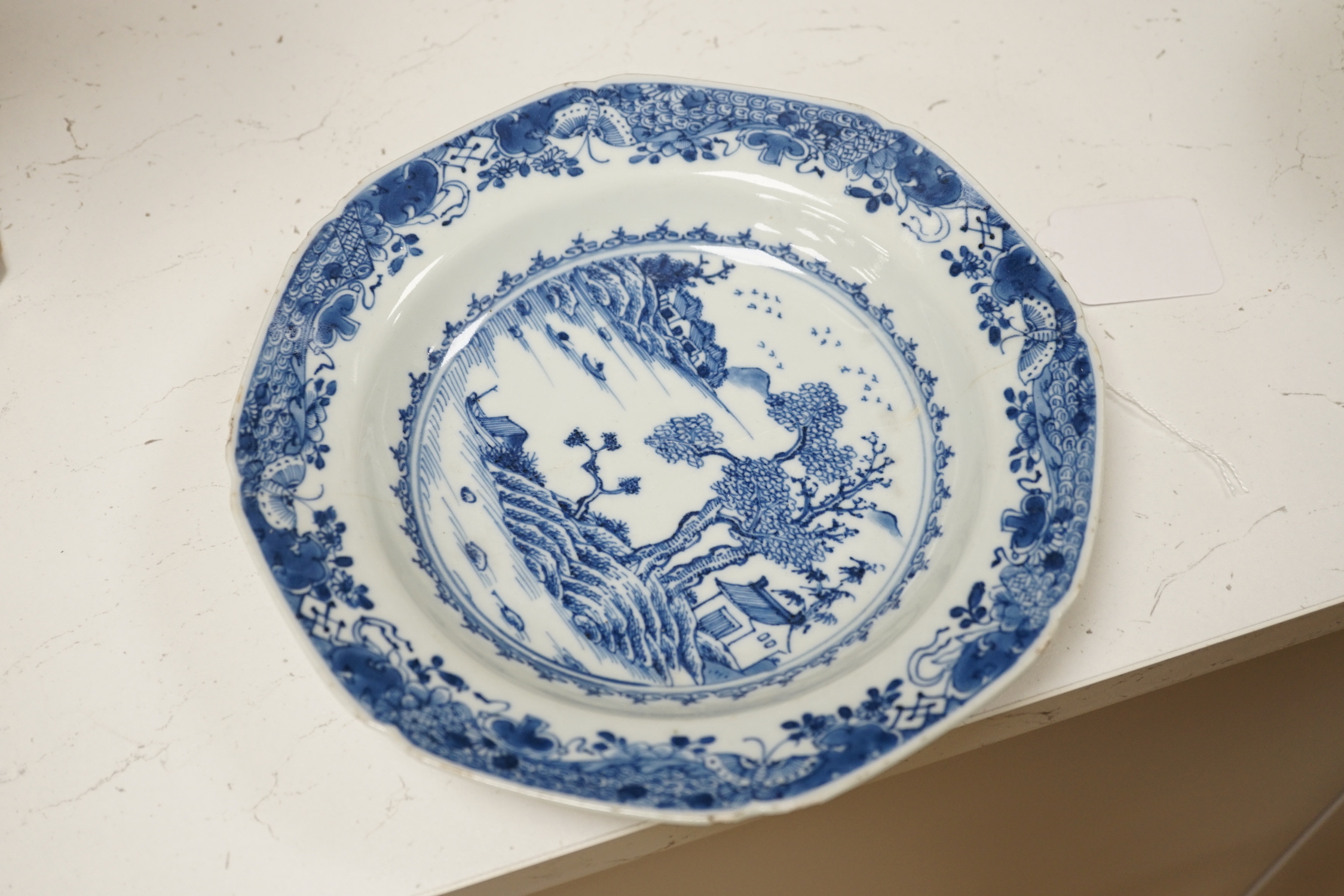Three Chinese blue and white dishes or plates, Kangxi to Qianlong period and two later covers, largest plate 32cm diameter